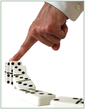 Hand collapsing row of dominoes